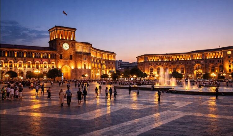 Yerevan Republic Square at evening with fountains and illuminated buildings